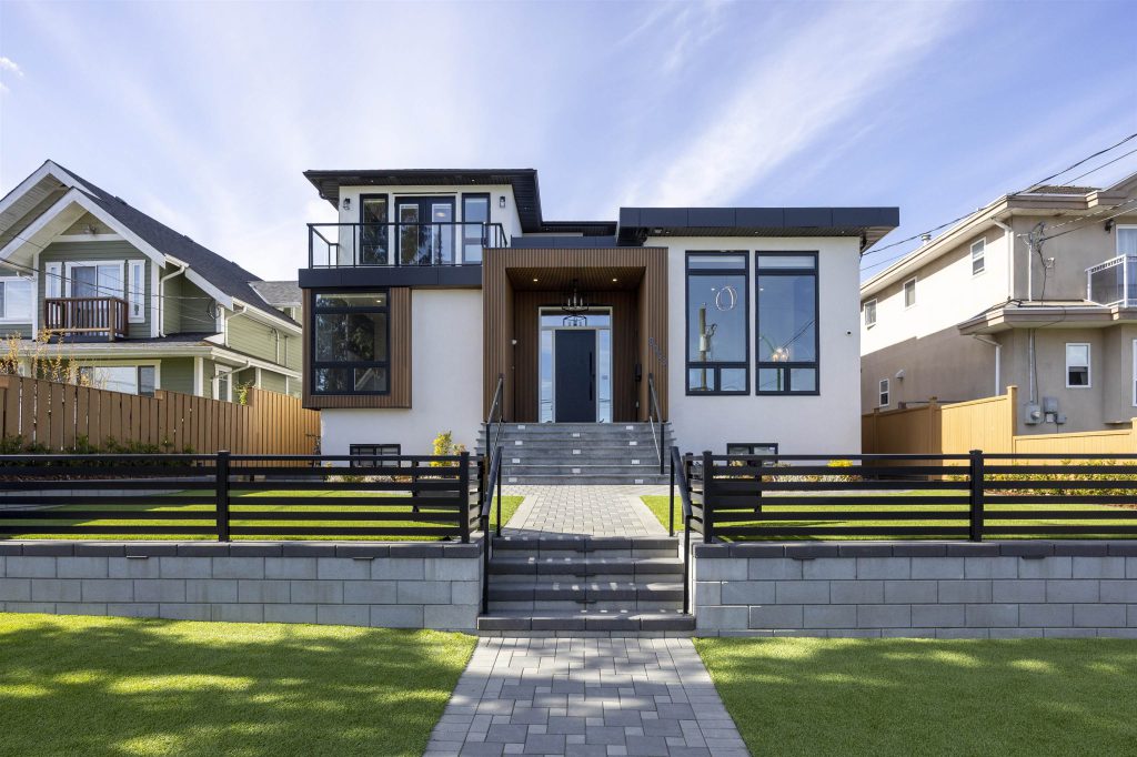 Pathway in Kensington featuring interlocking blocks and a smooth Allan Block retaining wall designed for a sloped grade between the road.