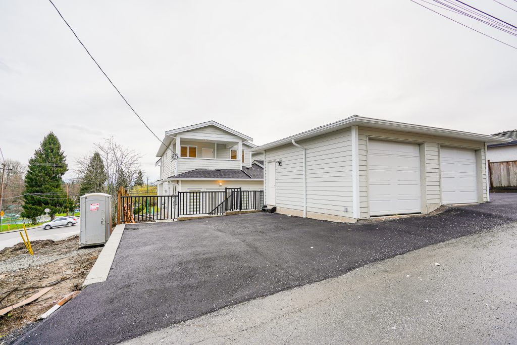 Burnaby backyard with a custom asphalt parking pad.